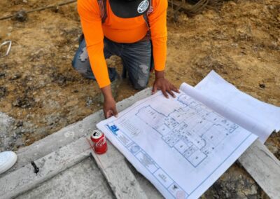 A man looking at a site plan