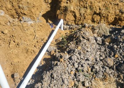 A white color pipe on the sand