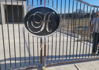 H logo on the gate