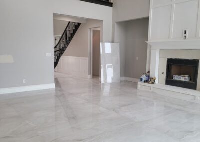 A spacious house with a large white marble floor, exuding elegance and sophistication.